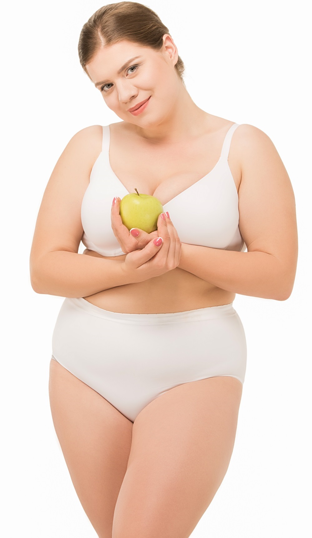 overweight woman in white underwear holding fresh apple, isolated on white